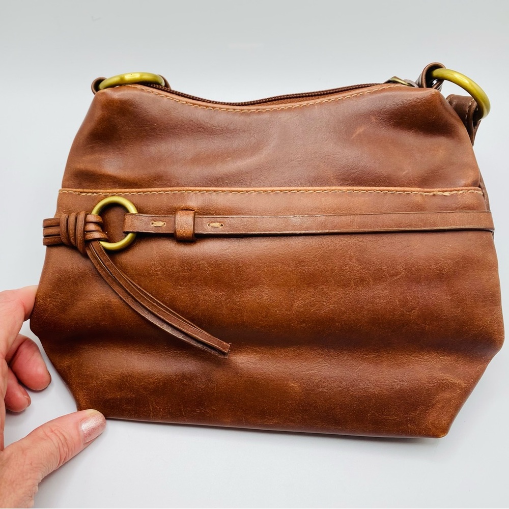 Faux soft brown leather small women’s purse with gold hardware accents.